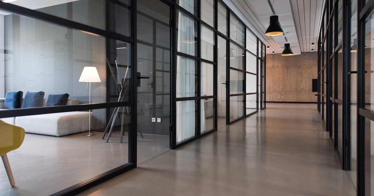 Private meeting rooms along a quiet office corridor